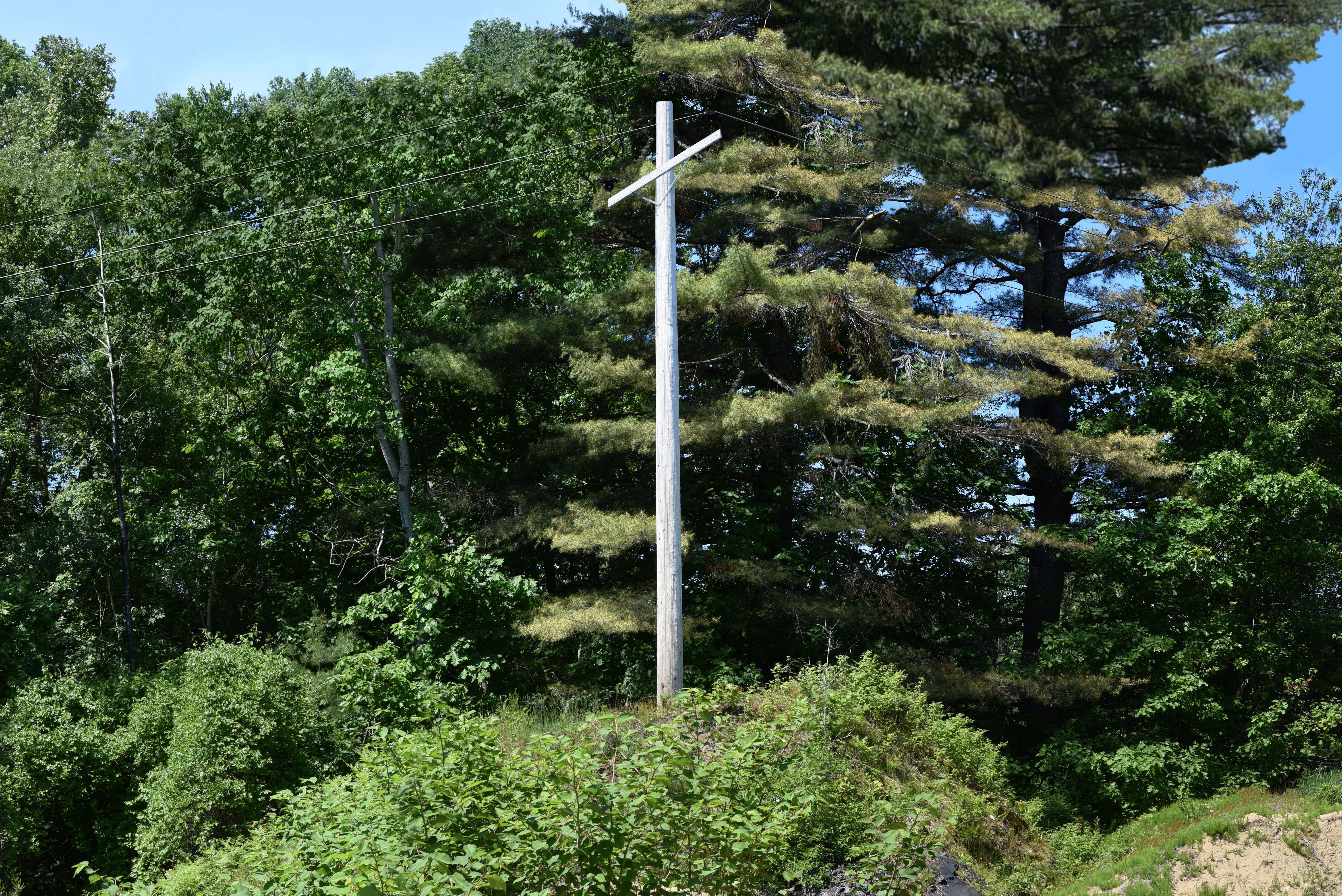 An existing wooden transmission line structure