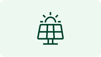 utility worker walking in front of a large transformer