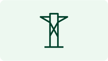 crew working on replacing a pole in front of a forested area